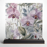Pastel Pink and Purple Lavender Orchid Blooms Ceramic Tile<br><div class="desc">Transform your space with the elegance and beauty of our exquisite ceramic tile, featuring a stunning design of delicate orchids. This tile showcases a harmonious blend of soft pastel hues, with large, intricately detailed orchid blossoms in shades of pink and lavender. The flowers are complemented by lush, muted green leaves,...</div>
