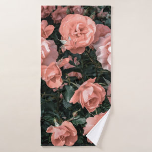 Pastel pink roses growing in the garden in soft li bath towel