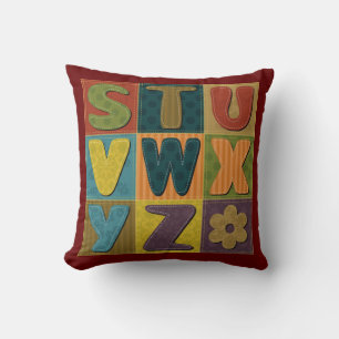 Patchwork Background with Alphabet Pattern Cushion