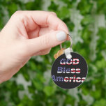 Patriotic Sentinel Keychain - Bold God Bless SUA<br><div class="desc">Carry a token of national pride wherever you go with this striking 'God Bless America' keychain. Featuring the powerful stars-and-stripes motif set against a sleek, high-contrast dark background, this durable accessory is more than just a key organizer—it's a daily affirmation of freedom. Perfect for veterans, active military, or any proud...</div>