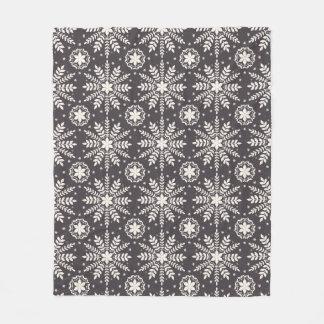 Pattern of white snowflakes fleece blanket