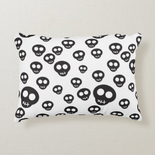 Pattern with black skulls on white decorative cushion