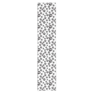 Pattern with black skulls on white short table runner