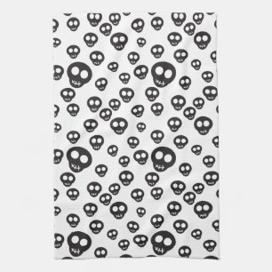 Pattern with black skulls on white tea towel