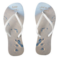 Paw prints and footprints in the sand