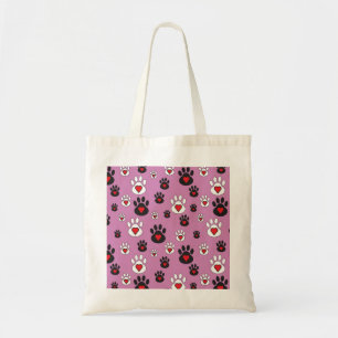 Paw prints with red hearts on pink  tote bag