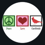 Peace Love Cardinals Classic Round Sticker<br><div class="desc">A pretty cardinal gift featuring a peace sign,  heart,  and beautiful red bird. A cute birding gift for a bird watcher that loves beautiful bird watching and collecting cool birds presents. Peace Love Cardinals.</div>