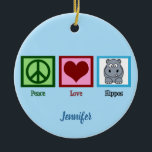 Peace Love Hippos Christmas Ceramic Ornament<br><div class="desc">Cute hippo Christmas ornament gift featuring a pretty green peace sign,  heart,  and an adorable cartoon hippopotamus. Peace Love Hippos. Personalise this with your name.</div>