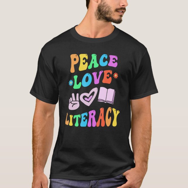 PEACE LOVE LITERACY Retro Reading Teacher Groovy B T-Shirt (Front)