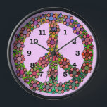 Peace Sign Symbol Flower Pretty Clock<br><div class="desc">This pretty, colourful clock features a retro peace sign / peace symbol with tie dye colours and brightly coloured flowers over it. It's a colourful floral design for proud hippies / lovers of world peace. The clock numbers are black and the background colour is light pink, but you can "customise...</div>