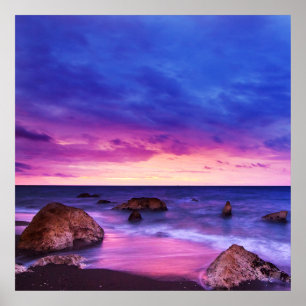 Peaceful Beach Sunset with Rocks and cloudy sky Poster