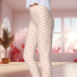 Peach Chequerboard Heart Valentine's Day Leggings<br><div class="desc">These Peach Chequerboard Heart Valentine's Day Leggings are perfect for celebrating the season of love. Featuring a charming peach and white chequerboard heart pattern, these leggings add a cute and romantic vibe to your Valentine's Day outfit. Made with comfortable, soft material, these leggings are a stylish choice for lounging or...</div>