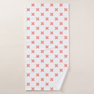 Peach cross stitches on white bath towel