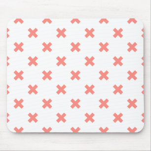 Peach cross stitches on white mouse pad