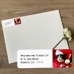 Peaches the Tuxedo Cat Christmas Address Labels<br><div class="desc">These return address labels feature Peaches the Tuxedo Cat wearing a Santa hat and bow looking up at you.  You can customise the design with your address.  Copyright Peaches the Tuxedo Cat</div>