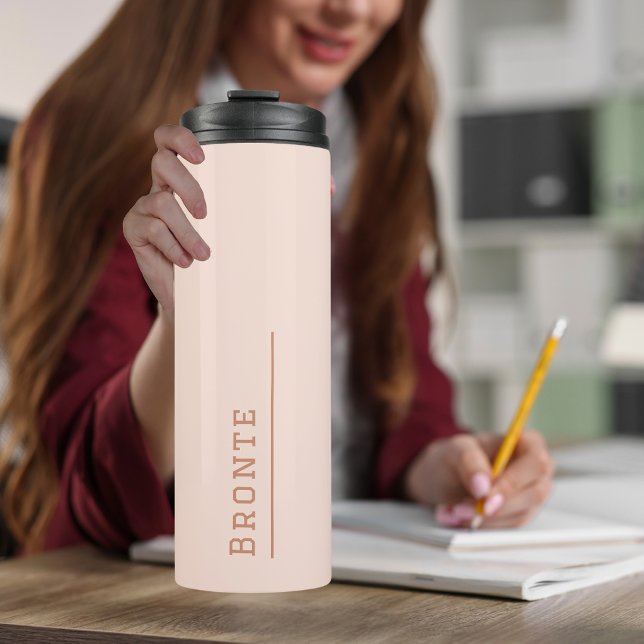 Peachy Coral - Colour Flow monogram Thermal Tumbler (A young woman holding a  monogrammed Thermal Tumbler travel mug in peach color with her name on it)