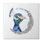 Peacock Silver Glitter Moon Tile<br><div class="desc">This is a watercolor painting of a peacock. The bird has beautiful blending colours of blue and green. The bird is looking very noble and proud. There is faux silver glitter circle around the bird.</div>