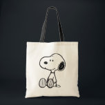 PEANUTS | Snoopy on Black White Comics Tote Bag<br><div class="desc">This Peanuts artwork features Snoopy sitting on background of black and white Charles M. Schulz comic strips.</div>