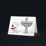 Peanuts | Snoopy & Woodstock Frozen Birdbath Holiday Card<br><div class="desc">Snoopy and Woodstock skating on a birdbath is a charming depiction from the "Peanuts" comic strip created by Charles Schulz. In this whimsical scene,  Woodstock,  Snoopy's best friend,  often engages in winter activities such as ice skating and playing hockey on a frozen birdbath.</div>