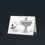 Peanuts | Snoopy & Woodstock Frozen Birdbath Holiday Card<br><div class="desc">Snoopy and Woodstock skating on a birdbath is a charming depiction from the "Peanuts" comic strip created by Charles Schulz. In this whimsical scene,  Woodstock,  Snoopy's best friend,  often engages in winter activities such as ice skating and playing hockey on a frozen birdbath.</div>