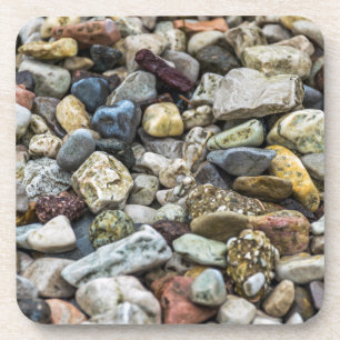 Pebbles on a beach hard plastic coasters