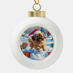 Pekingese Dog Running in Snow with Christmas Hat Ceramic Ball Christmas Ornament