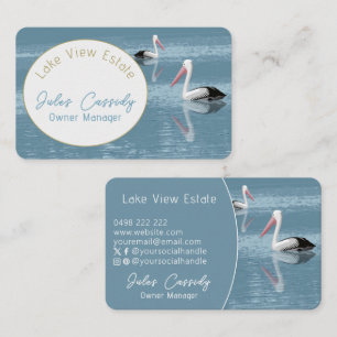 Pelican Couple Paddling on Calm Blue Water Oval Business Card