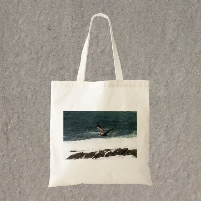 Pelican Flying Over Pacific Ocean Photo Tote Bag (A tote bag with a photograph of a pelican flying over the Pacific Ocean)
