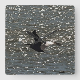 Pelican Flying Over Shimmering Lake Bafa Square Wall Clock