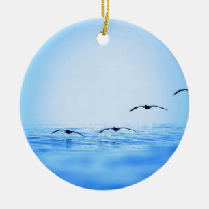 Pelicans flying over ocean ceramic tree decoration