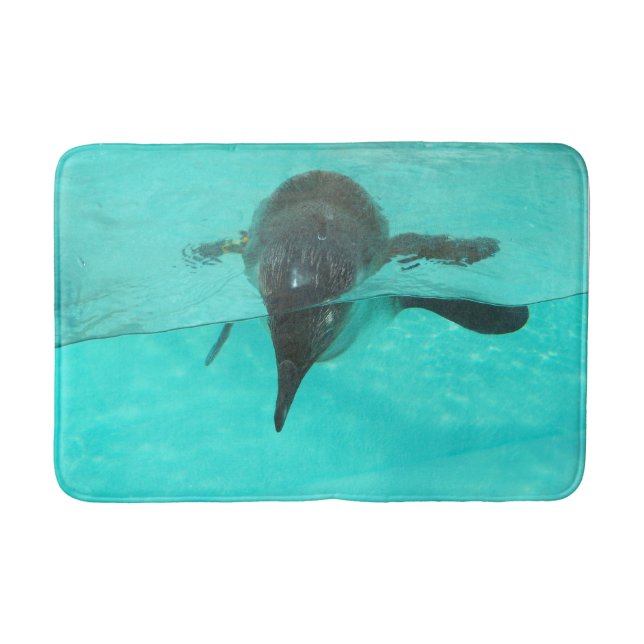 Penguin diving in blue water on a bath mat (Front)