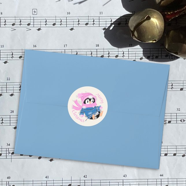 Penguin Entangled in Lights Christmas Sticker (Cute penguin entangles in Christmas light round Holiday sticker . )