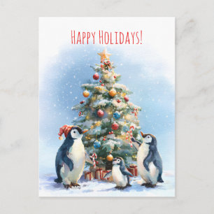 Penguin family joyfully decorating a Christmas tre Postcard