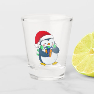 Penguin in a Christmas hat with a gift  Shot Glass