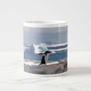 Penguin in front of an ice arch large coffee mug