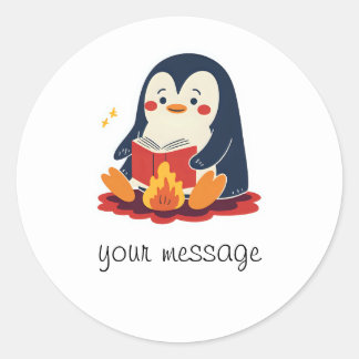 Penguin reading a book by a fireplace classic round sticker