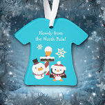 Penguin Snowman North Pole Kids Christmas Ornament<br><div class="desc">On this cute kids' Christmas ornament, a cute cartoon snowman and penguin bring Holiday greetings to your child! The snowman and penguin stand in front of a red and white striped pole with a sign that says North Pole with a snowflake floating down. The images are placed on a bright...</div>