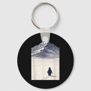 Penguin walking alone towards mountains motivation key ring