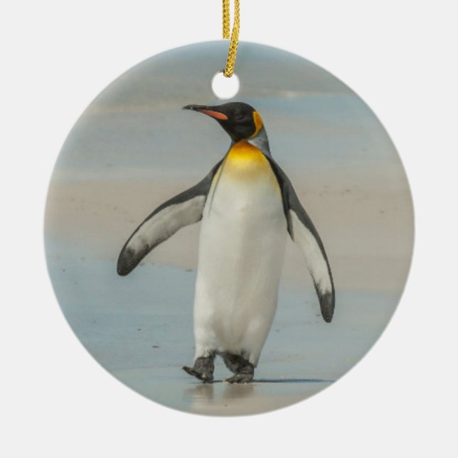 Penguin walking on the beach ceramic tree decoration (Front)