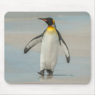 Penguin walking on the beach mouse pad