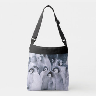 Penguins in snow crossbody bag