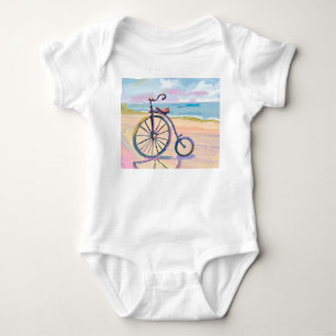 Penny farthing bike parked on beach baby bodysuit