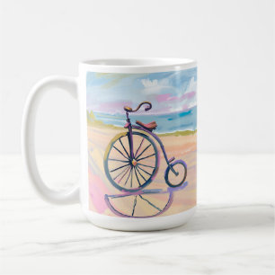 Penny farthing bike parked on beach coffee mug