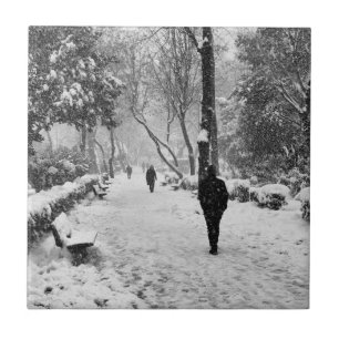 People at park in snowy winter day ceramic tile