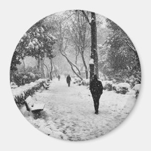 People at park in snowy winter day magnet