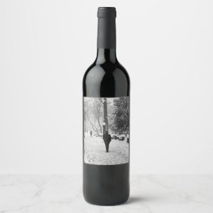 People at park in snowy winter day wine label