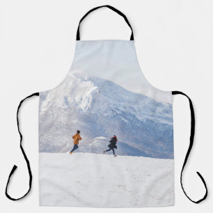 People having fun and running in mountains on the apron