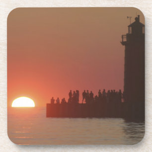 People lighthouse sunset silhouette at South Coaster