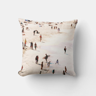 People on beach in the morning cushion