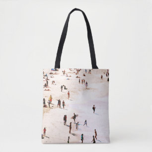 People on beach in the morning tote bag